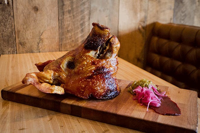 a sandwich sitting on top of a wooden table