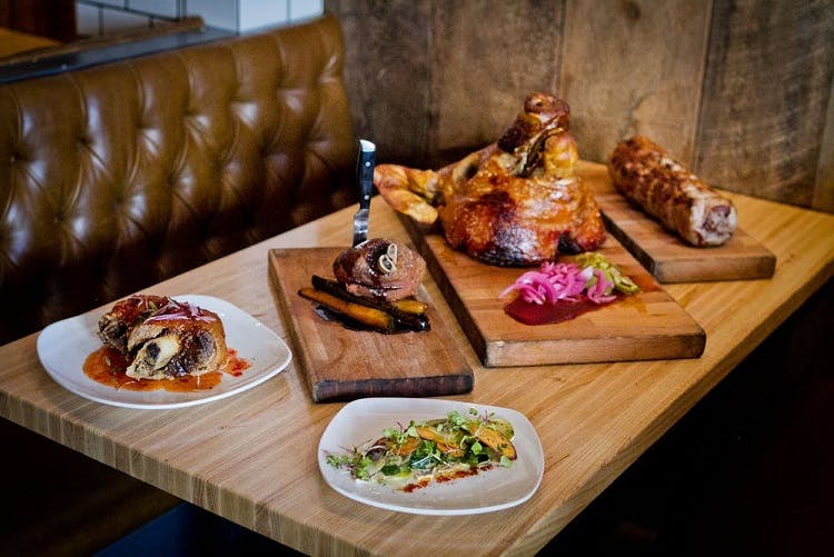 a sandwich sitting on top of a wooden table